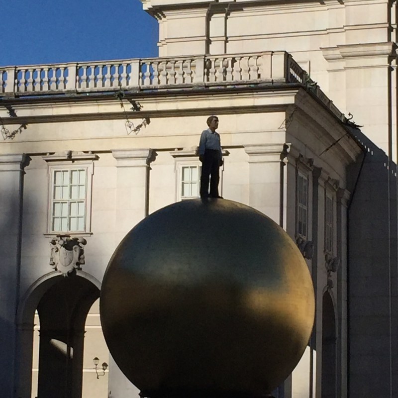 Big Man on Ball Sculpture